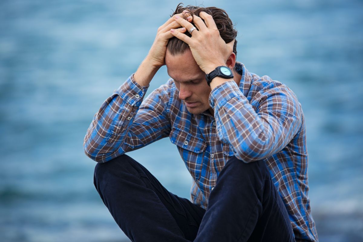 Testosterone therapy for men depicted by a stressed man possibly experiencing symptoms of low testosterone.