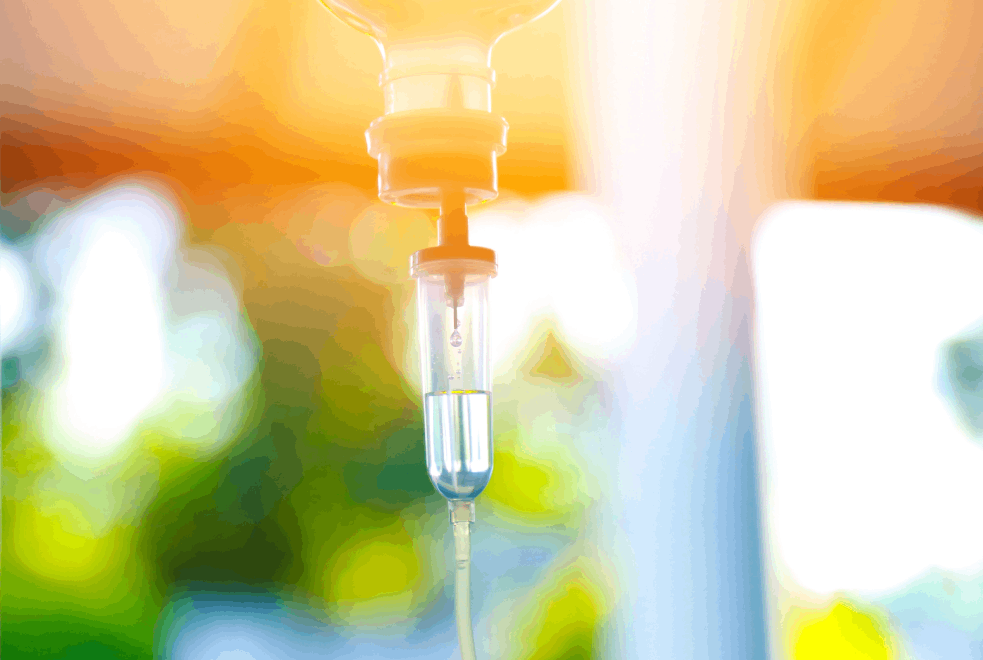 IV Vitamin Infusion drip bag with an orange and green glow