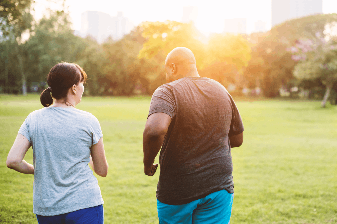 Man and woman running outside after learning about a promising new medication called Tirzepatide for weight loss.